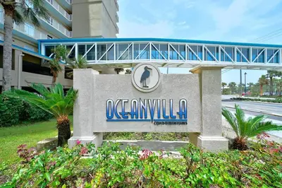 a sign in front of a building at Ocean Villa 1104 in Panama City Beach