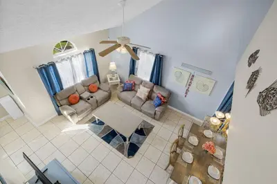 an overhead view of a living room with a couch and a table at 126 Seagrass Way in Panama City Beach