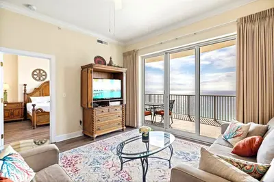 a living room with a couch and a tv at Ocean Villa 2101 in Panama City Beach