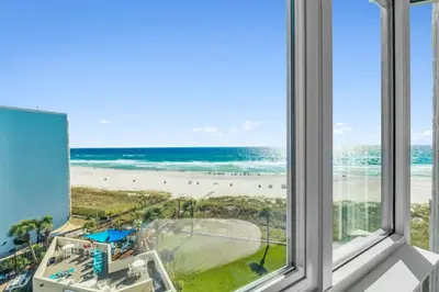 a view of the beach from the window of a condo at Top Of The Gulf 613 in Panama City Beach
