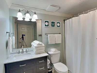 a bathroom with a sink and a toilet and a shower at Majestic Beach Towers I #1503 in Panama City Beach