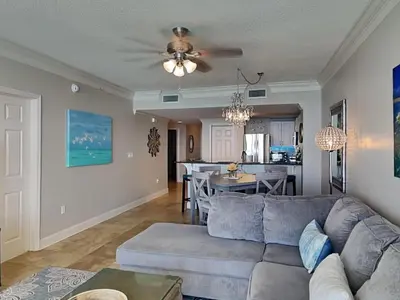 a living room with a couch and a table at Majestic Beach Towers I #1503 in Panama City Beach