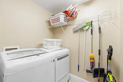 a laundry room with a washer and dryer at Emerald Coast Escapes in Panama City Beach