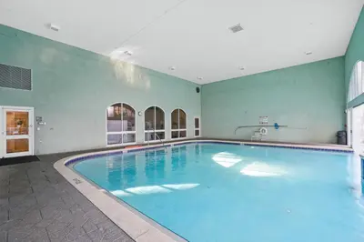 a large indoor swimming pool in a building at Emerald Coast Escapes in Panama City Beach