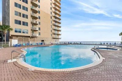 a large swimming pool in front of a building at Beautiful Beach front condo! - Tidewater 1804 in Panama City Beach