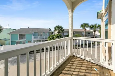 a balcony with a view of the beach at The Palms A6 in Panama City Beach