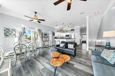 a living room with a couch and a table at The Palms A6 in Panama City Beach