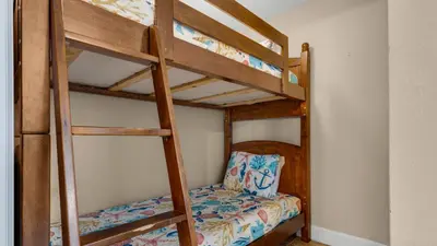 a bedroom with two bunk beds in a room at Tidewater 1312 in Panama City Beach