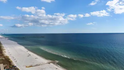 an aerial view of a beach and the ocean at Tidewater 1312 in Panama City Beach