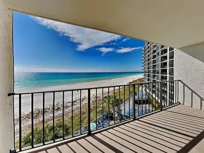 a balcony with a view of a beach and the ocean at Edgewater Tower Iii 504 in Panama City Beach
