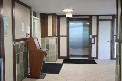 a lobby with a hallway with a door and a hallwayngthngthngthngthngth at AQUA 1504 Beachfront condo with Free Beach Chairs in Panama City Beach