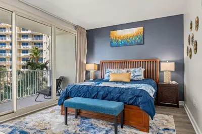 a bedroom with a bed and a large window at Shores Of Panama #0323 in Panama City Beach