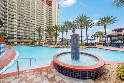 a pool at a resort with a large building at Shores Of Panama #0323 in Panama City Beach