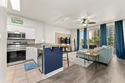 an open kitchen and living room in a apartment at Shores Of Panama #0323 in Panama City Beach