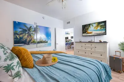 a bedroom with a bed with a hat on it at Shores Of Panama #0912 in Panama City Beach