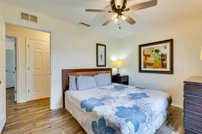 a bedroom with a bed and a ceiling fan at PCB Condo with Pool Access 1 Mi to Beach! in Panama City Beach