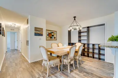 a dining room with a table and chairs at PCB Condo with Pool Access 1 Mi to Beach! in Panama City Beach