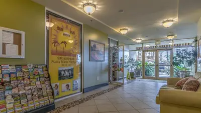 a lobby of a store with a couch in a room at Shores of Panama #1420 by Nautical Properties in Panama City Beach