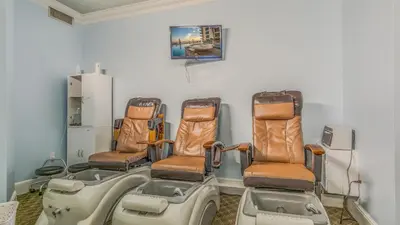 a group of chairs sitting on a table in a room at Shores of Panama #1420 by Nautical Properties in Panama City Beach