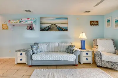 a living room with a couch and two chairs at Panama City Beach Getaway - Walk to Beaches! in Panama City Beach