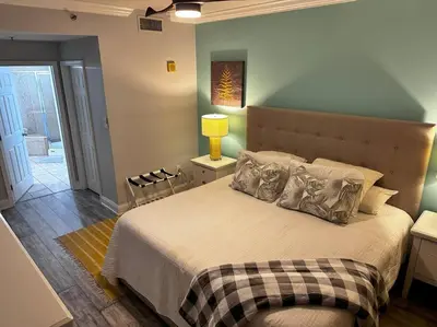 a bedroom with a large bed with pillows on it at Melan Villa Costal Magic Ocean View in Panama City Beach