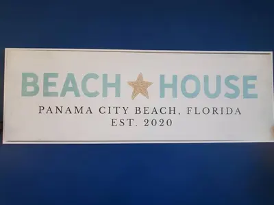 a sign for a beach house with a star on it at Melan Villa Costal Magic Ocean View in Panama City Beach
