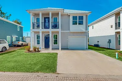 a large white house with a garage at Walk to Eats! Family Hideaway 16 Mi to PCB in Callaway