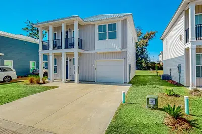 a large white house with a garage at Walk to Eats! Family Hideaway 16 Mi to PCB in Callaway