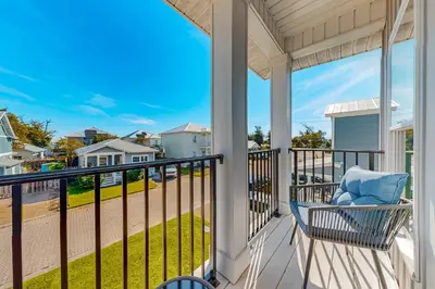 a porch with a chair and a view of the street at Walk to Eats! Family Hideaway 16 Mi to PCB in Callaway