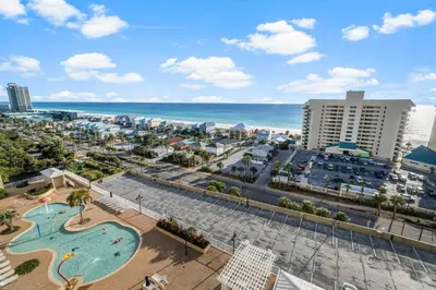 an aerial view of a resort with a pool and the ocean at Laketown Wharf #1007 by Nautical Properties in Panama City Beach