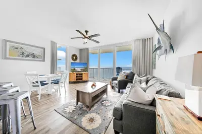 a living room with a couch and a table at Majestic Beach Towers 1-2015 in Panama City Beach