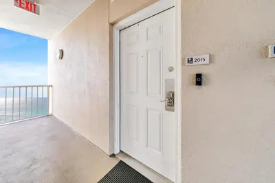 an open door in a room with a balcony at Majestic Beach Towers 1-2015 in Panama City Beach