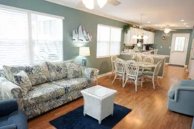 a living room with a couch and a table at Venture Out 79 Gulf Loop Comes With Golf Cart in Panama City Beach