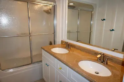 a bathroom with a sink and a shower at Venture Out 41 Gulf Loop 2bd 1ba WITH GOLF CART in Panama City Beach