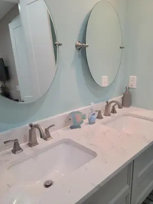 a bathroom with a sink and a mirror at Venture Out 600 Seabreeze Dr Comes WITH GOLF CART in Panama City Beach