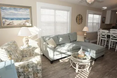 a living room with a couch and a table at Venture Out 476 Marlin Dr Comes WITH GOLF CART in Panama City Beach