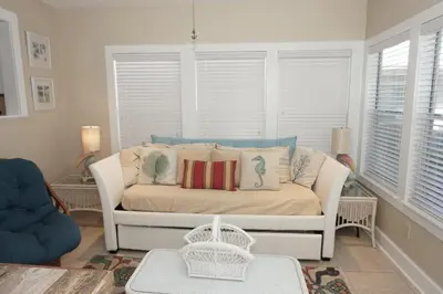 a living room with a couch with pillows on it at Venture Out 476 Marlin Dr Comes WITH GOLF CART in Panama City Beach