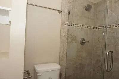 a bathroom with a shower with a toilet at Venture Out 476 Marlin Dr Comes WITH GOLF CART in Panama City Beach