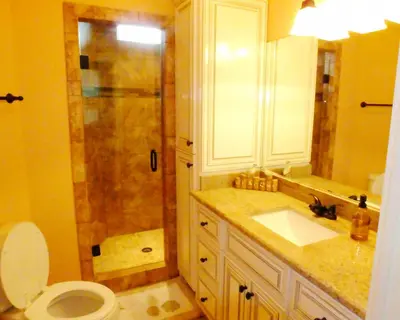 a bathroom with a shower and a toilet and a sink at Venture Out 152 Gulf Loop With Golf Cart in Panama City Beach