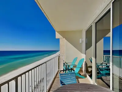 a balcony with chairs and a view of the ocean at Shores of Panama #1330 in Panama City Beach