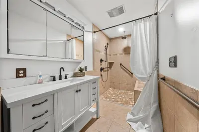 a bathroom with a sink and a shower at 4BD Resort Home Golf Cart Inc 11 Pools in Panama City Beach