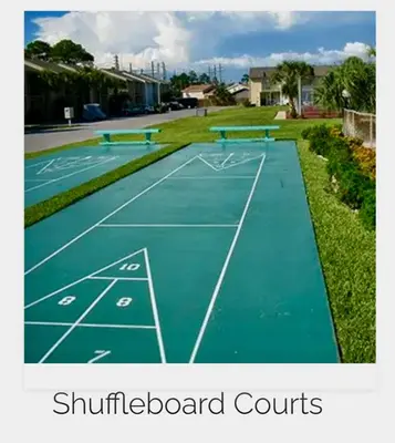 a tennis court with two tables on it at 4BD Resort Home Golf Cart Inc 11 Pools in Panama City Beach