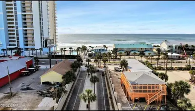 an aerial view of a city with the ocean at 4BD Resort Home Golf Cart Inc 11 Pools in Panama City Beach