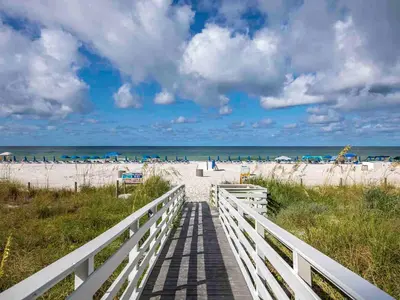 a boardwalk leading to a beach with the ocean at Twin Palms #1501A in Panama City Beach