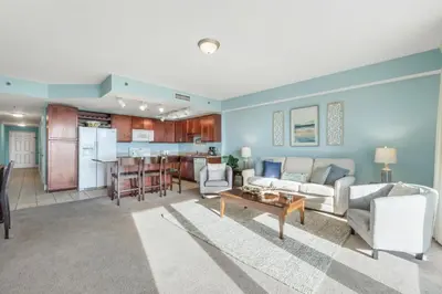 a living room with a couch and a table at Laketown Wharf #1014 in Panama City Beach