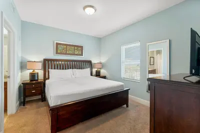 a bedroom with a bed and a television in it at Laketown Wharf #1115 in Panama City Beach