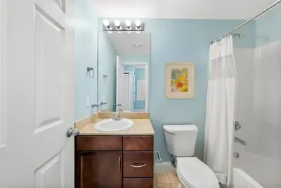 a bathroom with a sink and a toilet and a shower at Laketown Wharf #1206 in Panama City Beach