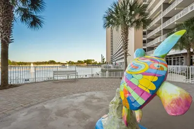 a statue of a colorful fish on a rock at Laketown Wharf #0127 in Panama City Beach
