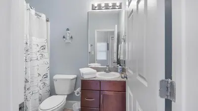 a bathroom with a toilet and a sink and a shower at Laketown Wharf #2025 in Panama City Beach