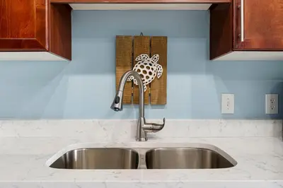 a kitchen counter with a sink in a kitchen at Laketown Wharf 2032 in Panama City Beach